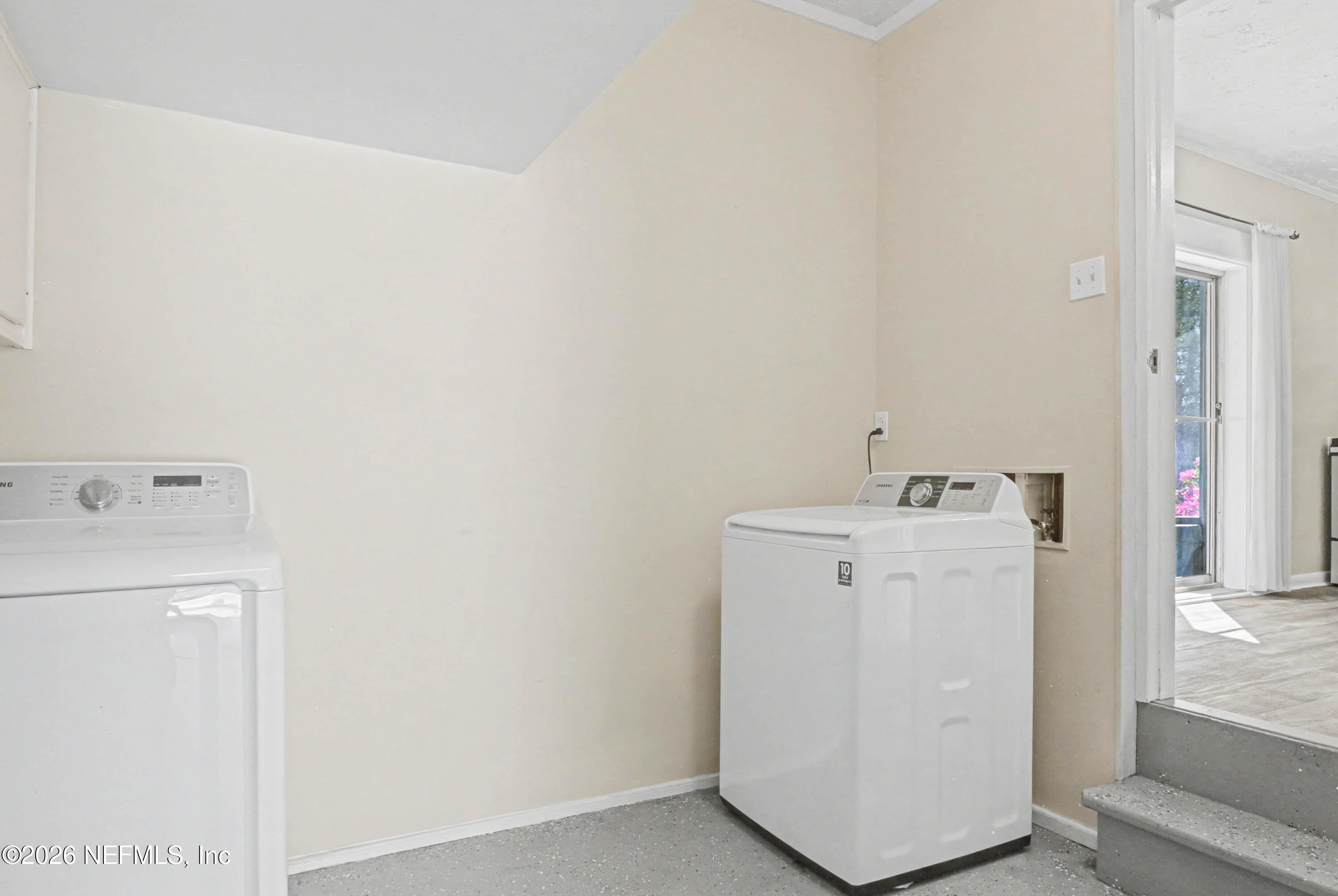 215 Orchis Road St. Augustine, FL 32086 - Photo 25 of 51 a utility room with dryer and washer