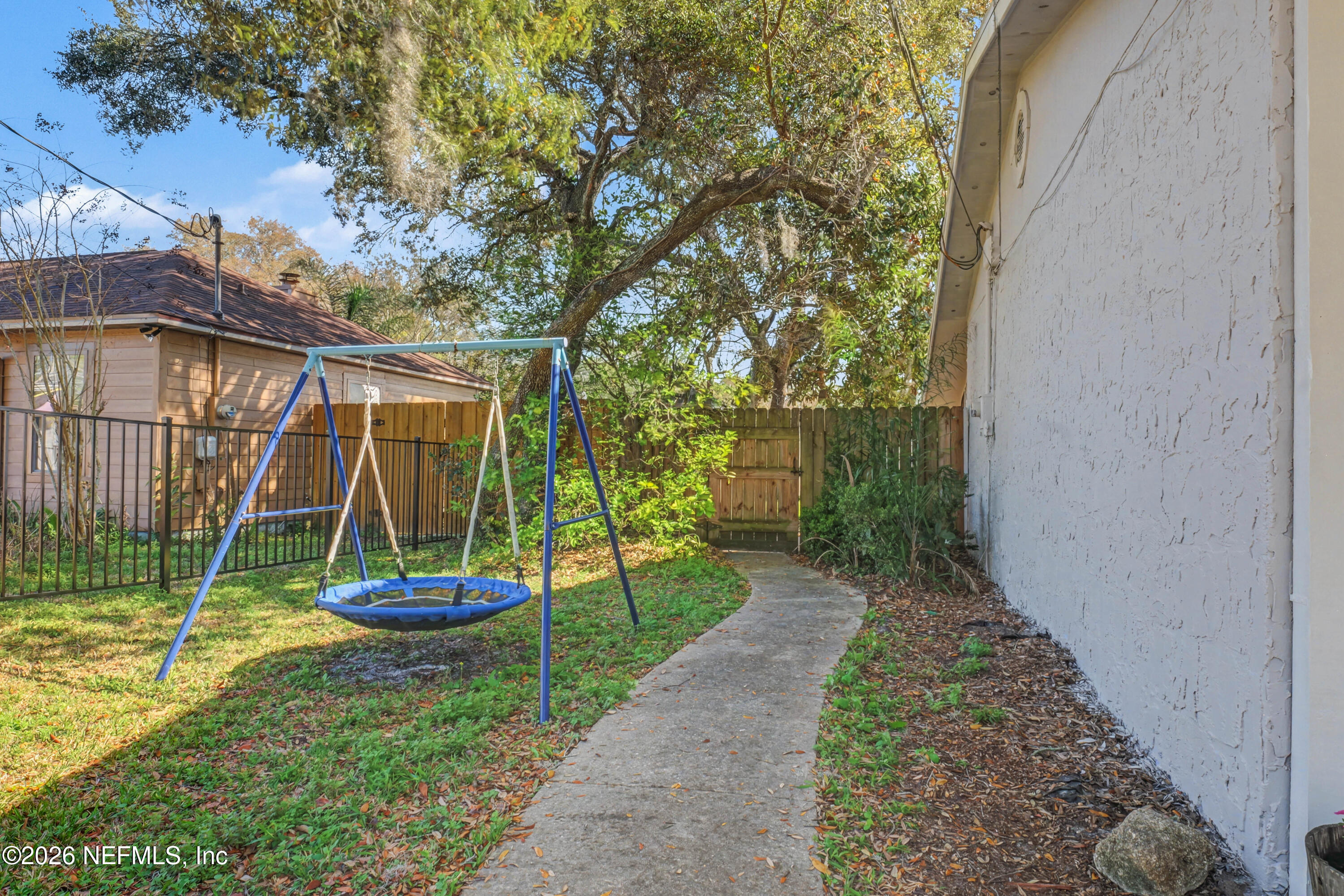 215 Orchis Road St. Augustine, FL 32086 - Photo 27 of 51 a view of a chair and table in backyard of the house