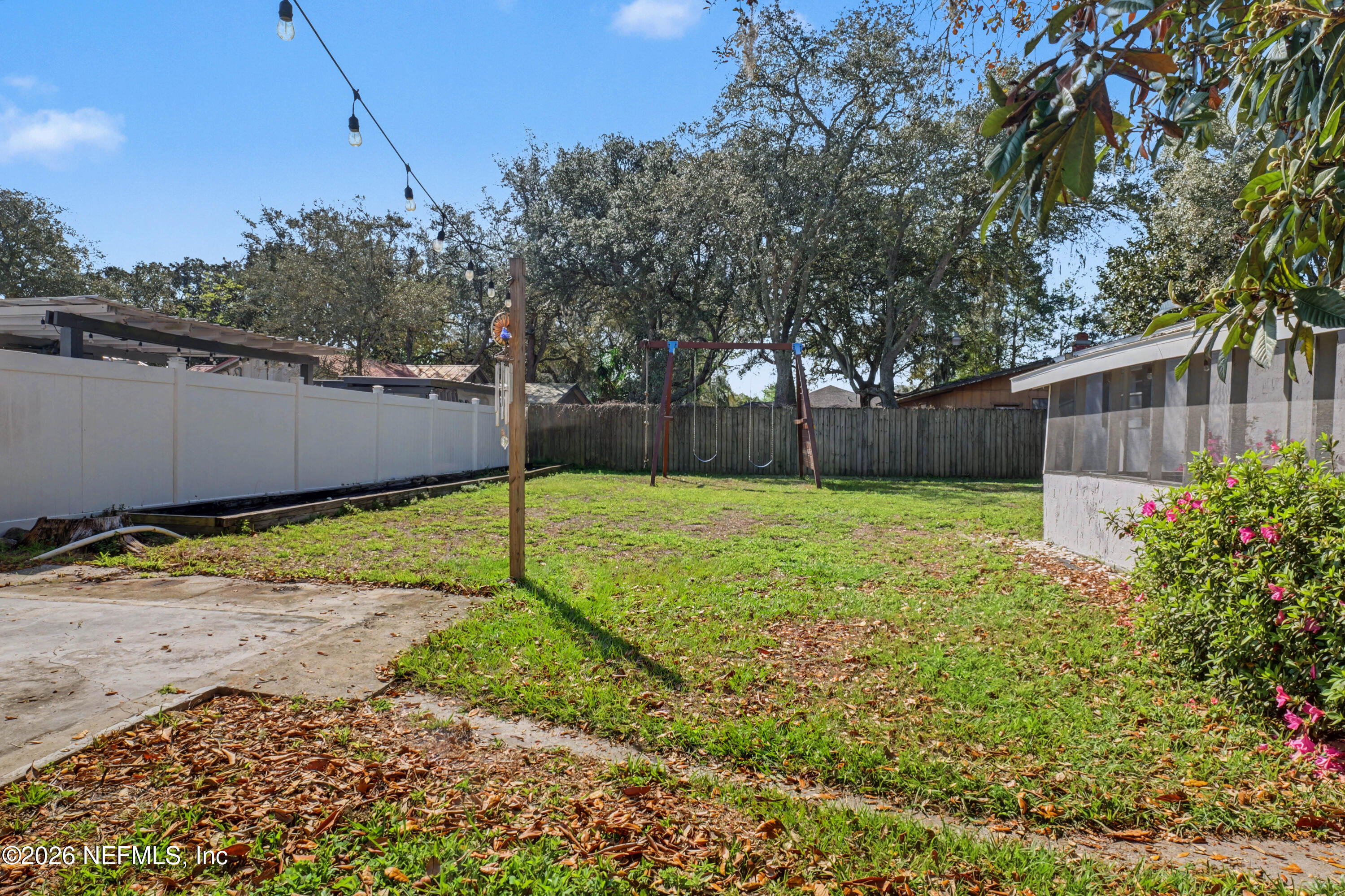 215 Orchis Road St. Augustine, FL 32086 - Photo 34 of 51 a view of a backyard with a garden