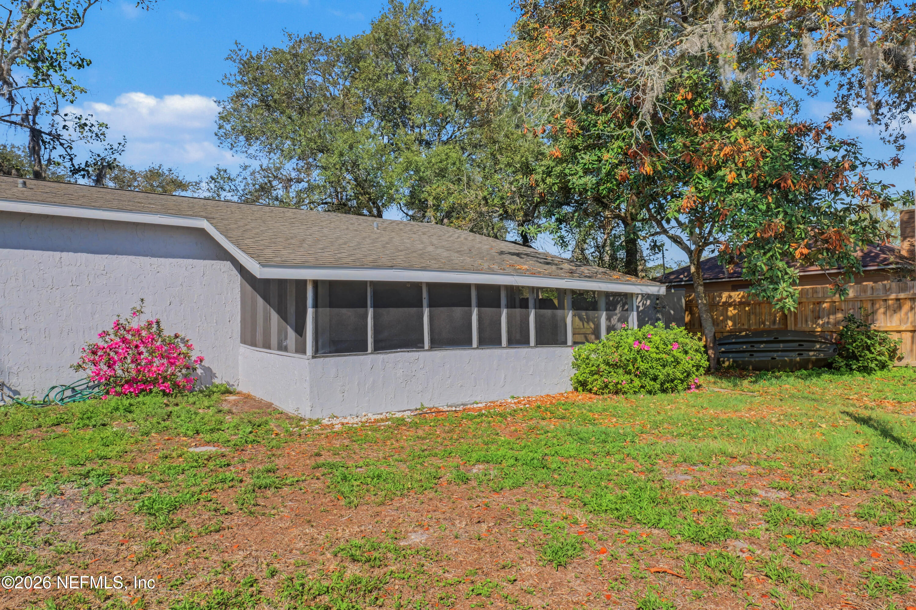 215 Orchis Road St. Augustine, FL 32086 - Photo 36 of 51 a view of a house with a yard and potted plants