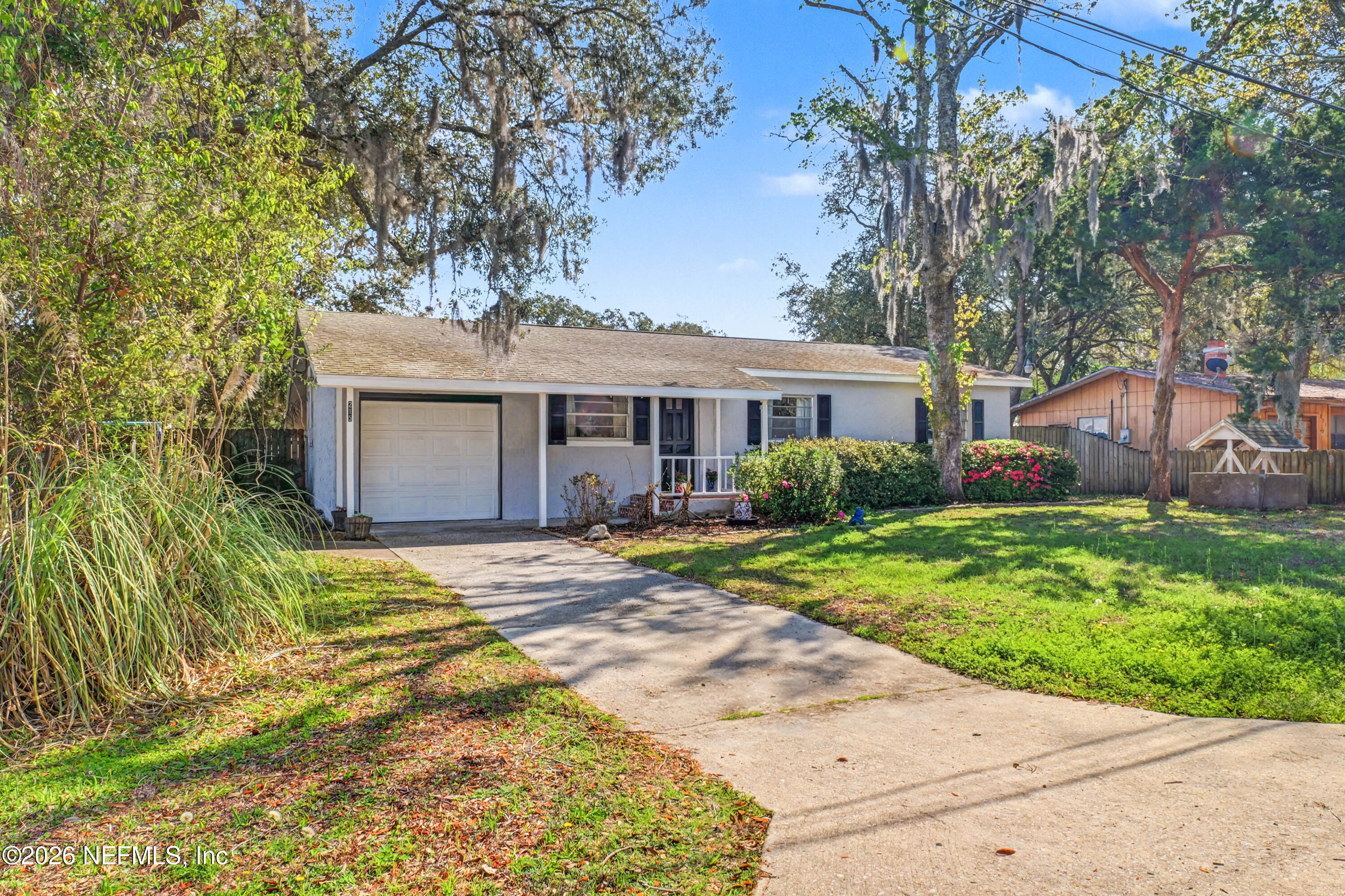 215 Orchis Road St. Augustine, FL 32086 - Photo 43 of 51 a view of a house with a yard and large tree