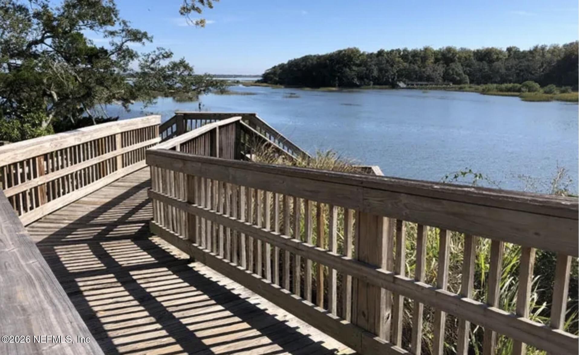 215 Orchis Road St. Augustine, FL 32086 - Photo 47 of 51 a view of a balcony with wooden floor and lake view