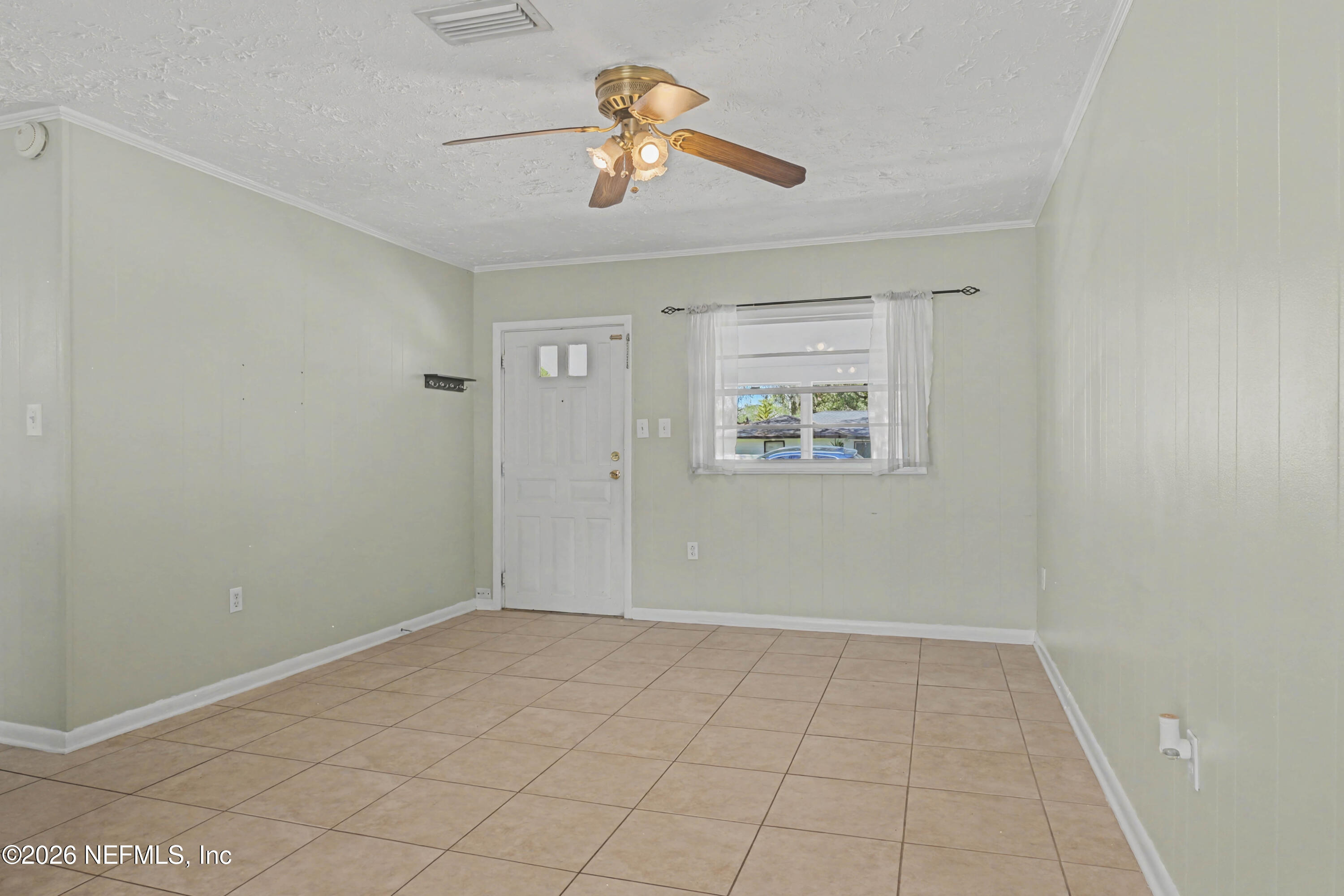215 Orchis Road St. Augustine, FL 32086 - Photo 6 of 51 wooden floor in an empty room with a window