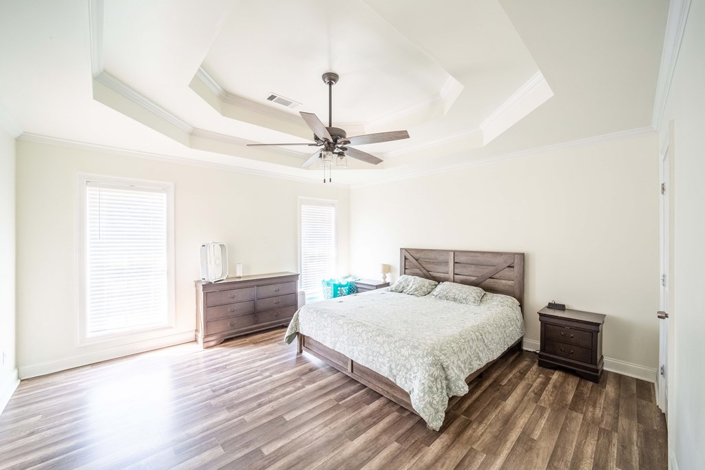 28 Whippoorwill Lane Fort Mitchell, AL 36856 - Photo 14 of 19 a bedroom with a bed and a dresser