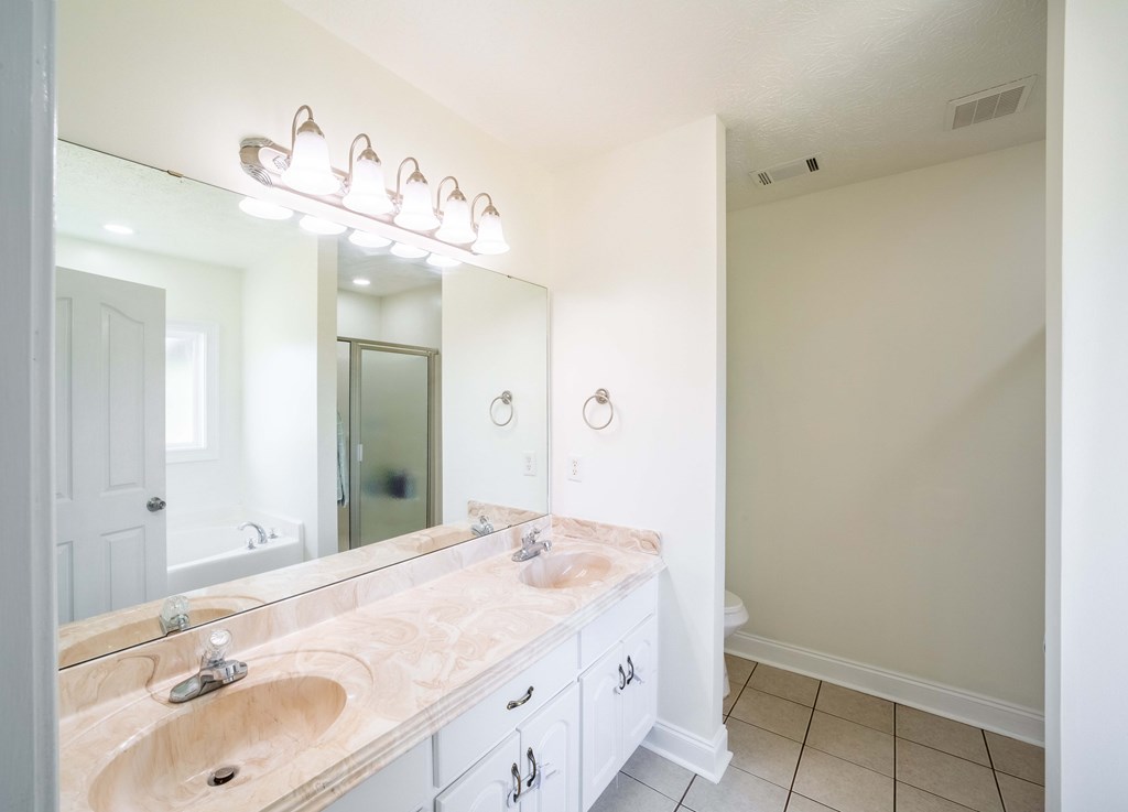 28 Whippoorwill Lane Fort Mitchell, AL 36856 - Photo 15 of 19 a bathroom with a sink and a mirror