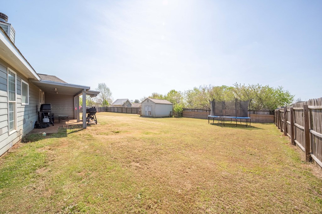 28 Whippoorwill Lane Fort Mitchell, AL 36856 - Photo 19 of 19 a view of a swimming pool and a yard