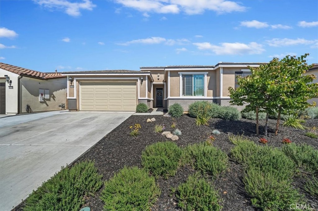 12766 Blush Court Riverside, CA 92503 - Photo 1 of 55 a front view of a house with a yard and garage