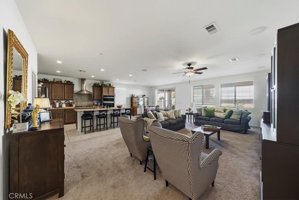 12766 Blush Court Riverside, CA 92503 - Photo 16 of 55 a living room with lots of furniture and a large window