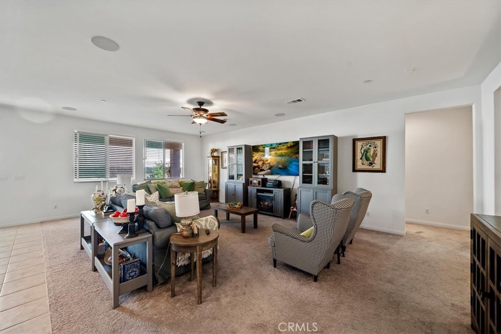 12766 Blush Court Riverside, CA 92503 - Photo 19 of 55 a living room with furniture and a flat screen tv
