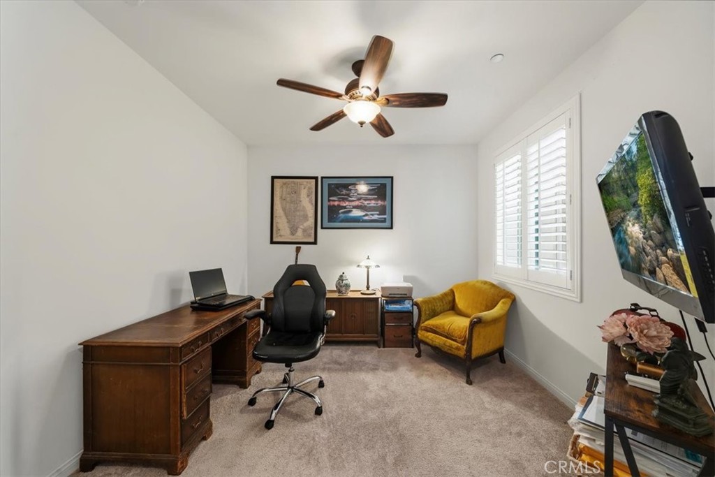 12766 Blush Court Riverside, CA 92503 - Photo 20 of 55 a view of a workspace with furniture and a window