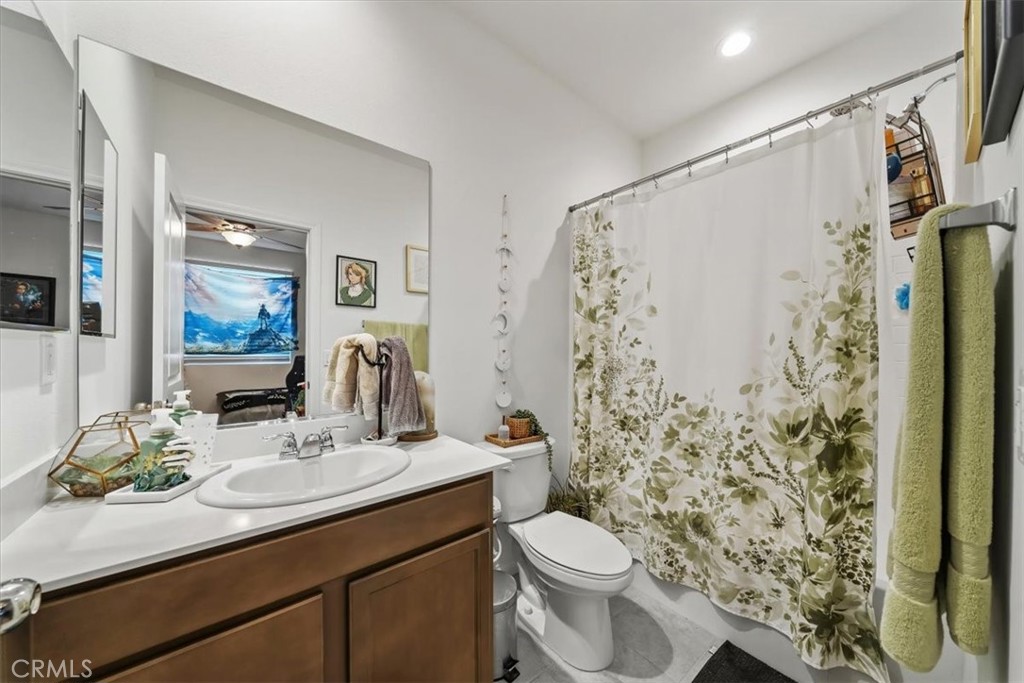 12766 Blush Court Riverside, CA 92503 - Photo 23 of 55 a bathroom with a sink toilet and shower