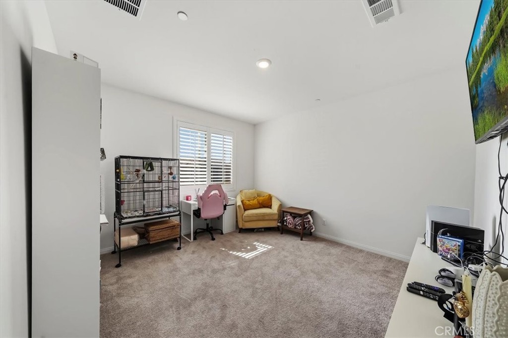 12766 Blush Court Riverside, CA 92503 - Photo 27 of 55 a bedroom with furniture and a window