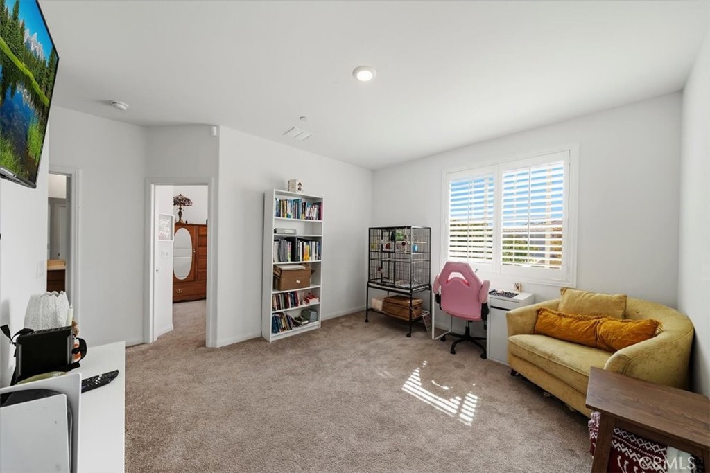 12766 Blush Court Riverside, CA 92503 - Photo 28 of 55 a living room with furniture and a flat screen tv