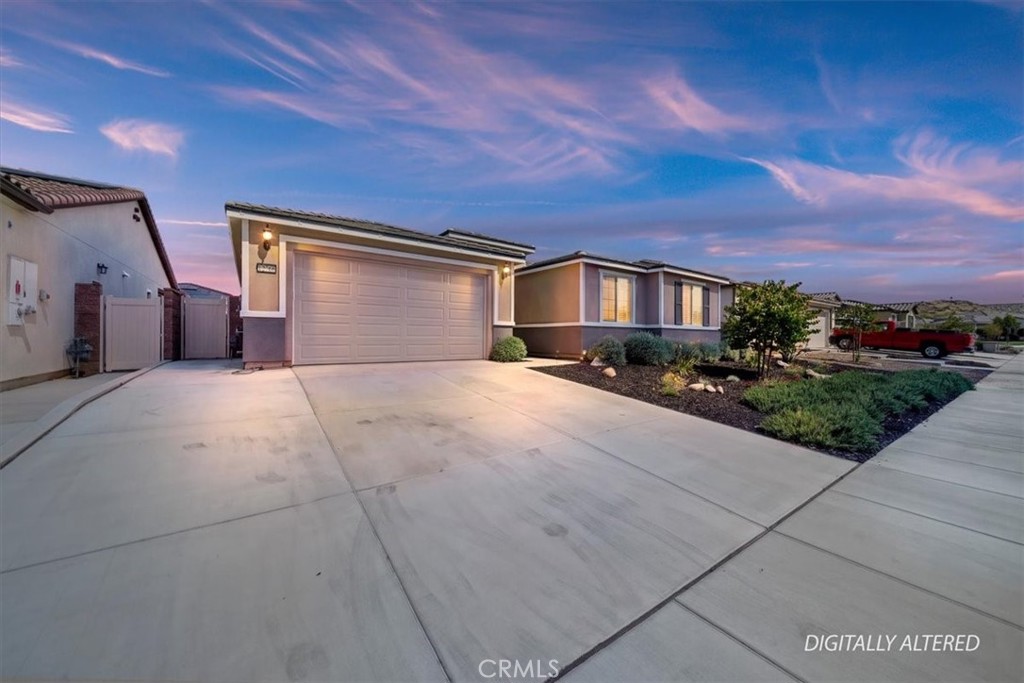 12766 Blush Court Riverside, CA 92503 - Photo 3 of 55 a front view of a house with a yard