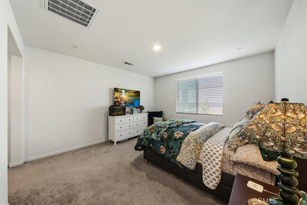 12766 Blush Court Riverside, CA 92503 - Photo 33 of 55 a bedroom with a bed and a window