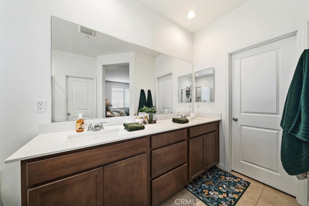 12766 Blush Court Riverside, CA 92503 - Photo 36 of 55 a bathroom with a sink and a mirror