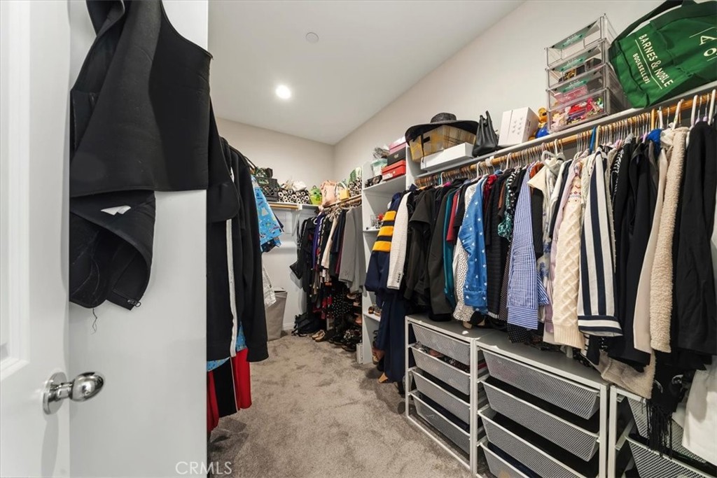 12766 Blush Court Riverside, CA 92503 - Photo 37 of 55 a view of walk in closet with clothes and shoes
