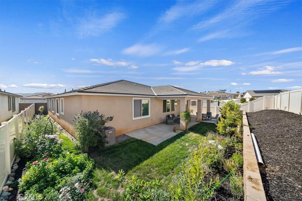 12766 Blush Court Riverside, CA 92503 - Photo 40 of 55 a front view of a house with garden