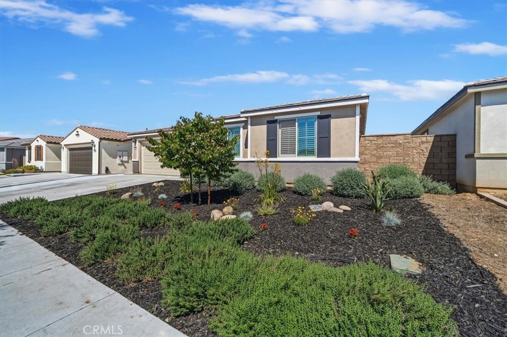 12766 Blush Court Riverside, CA 92503 - Photo 4 of 55 a house view with a garden space