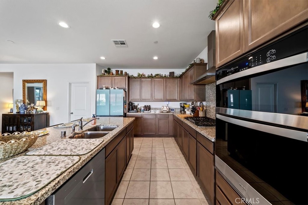 12766 Blush Court Riverside, CA 92503 - Photo 10 of 55 a large kitchen with granite countertop lots of counter top space