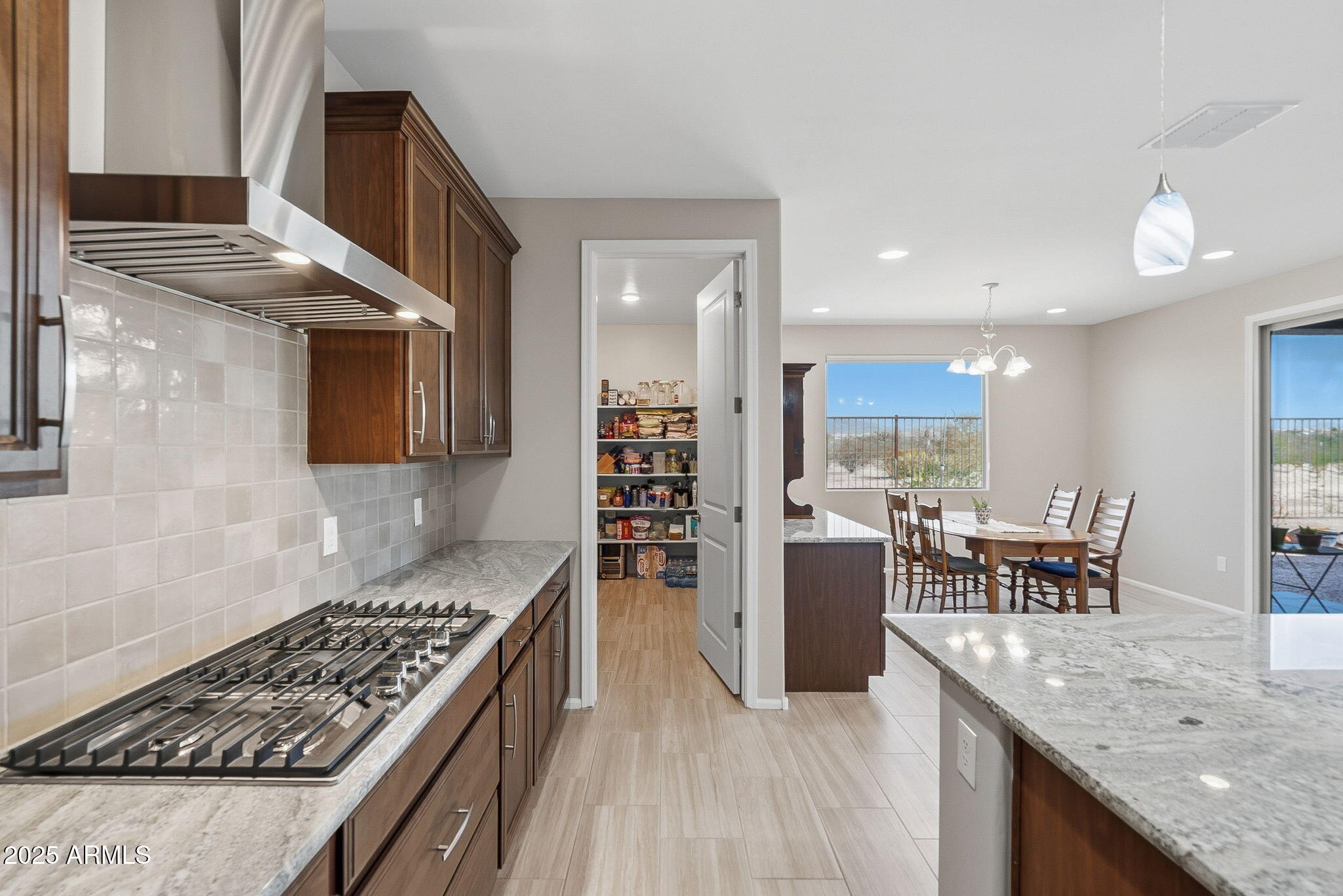 5439 South Sierra Prieta Trail Tucson, AZ 85747 - Photo 11 of 71 a kitchen with counter top space appliances and furniture