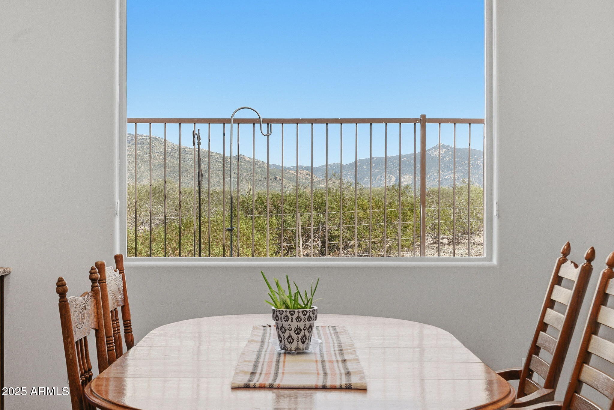 5439 South Sierra Prieta Trail Tucson, AZ 85747 - Photo 14 of 71 a view of a dining room with furniture window and wooden floor