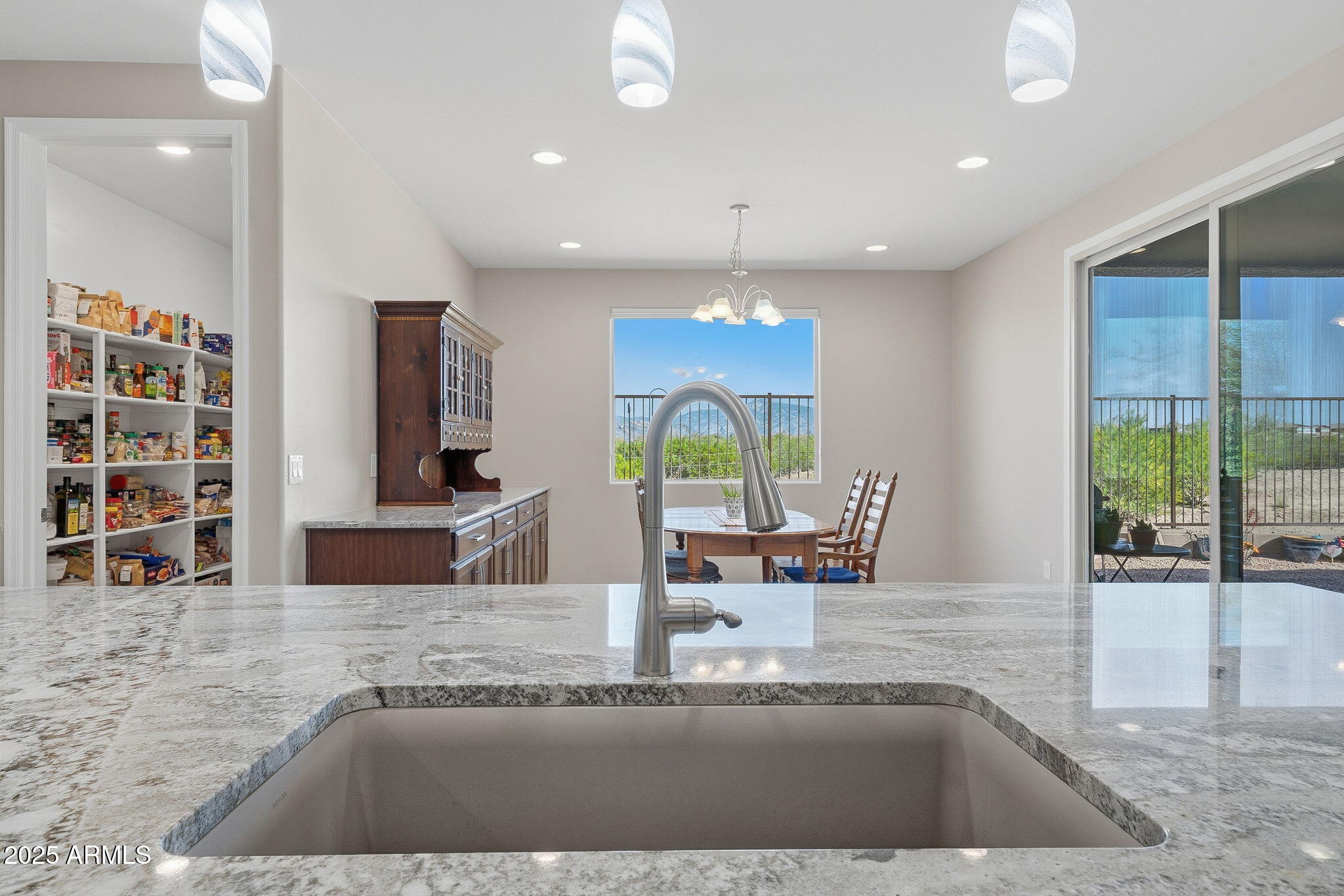 5439 South Sierra Prieta Trail Tucson, AZ 85747 - Photo 15 of 71 a view of kitchen with granite countertop window and dining table