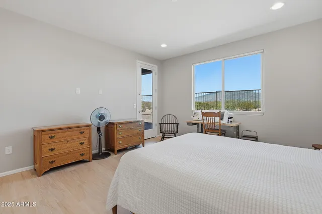 a bathroom with a granite countertop sink a mirror and shower