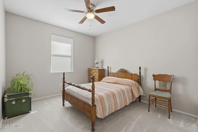 a bedroom with two beds and painted walls