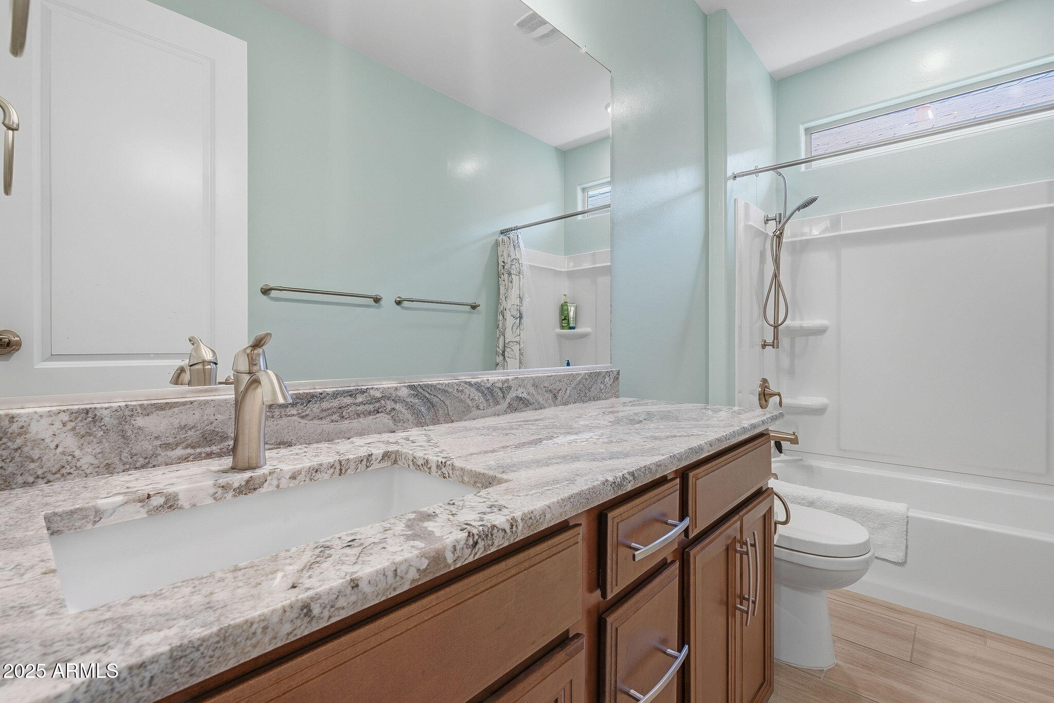 5439 South Sierra Prieta Trail Tucson, AZ 85747 - Photo 29 of 71 a bathroom with a granite countertop sink a toilet and shower