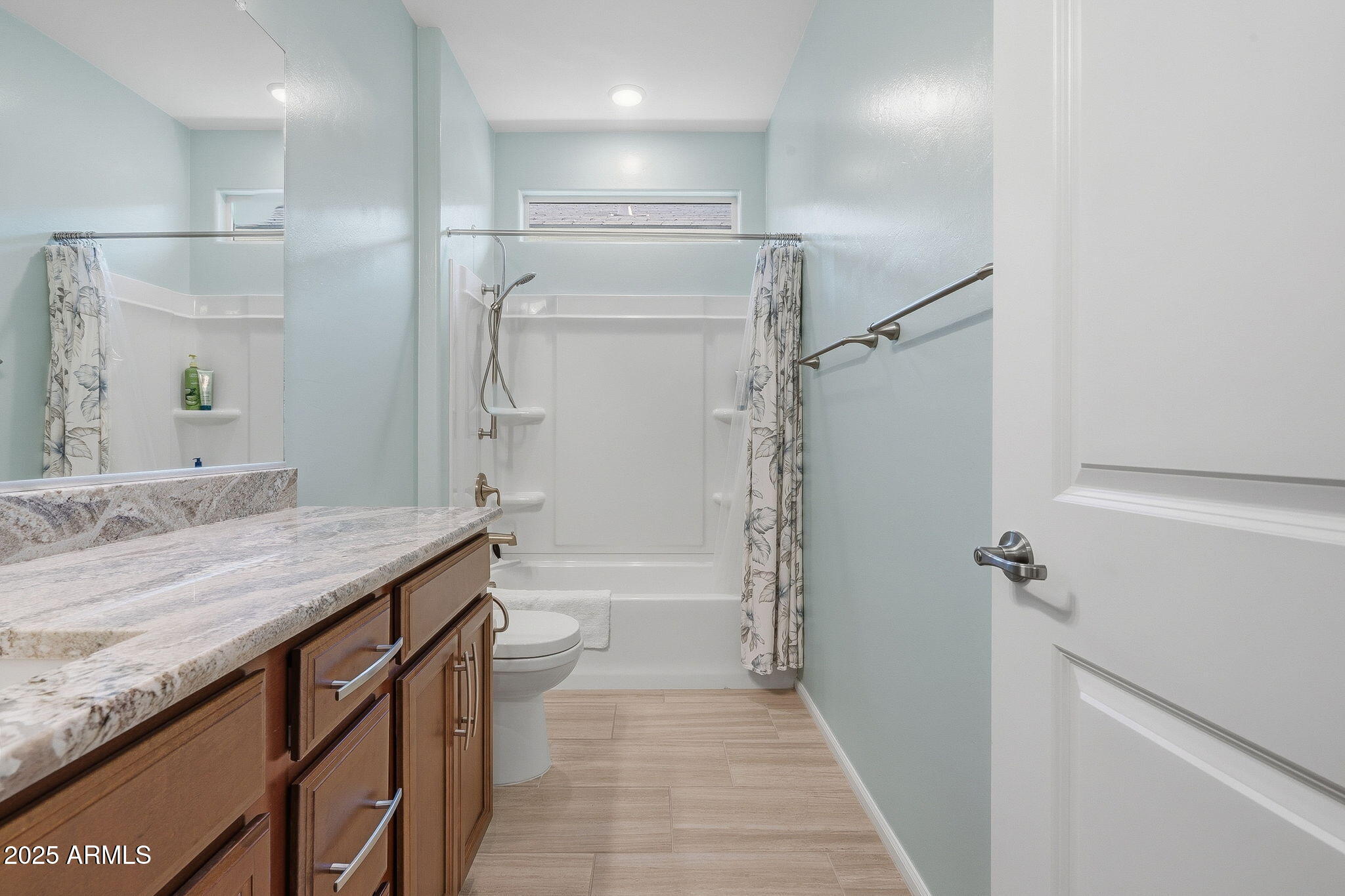 5439 South Sierra Prieta Trail Tucson, AZ 85747 - Photo 30 of 71 a bathroom with a granite countertop sink a toilet a mirror and shower