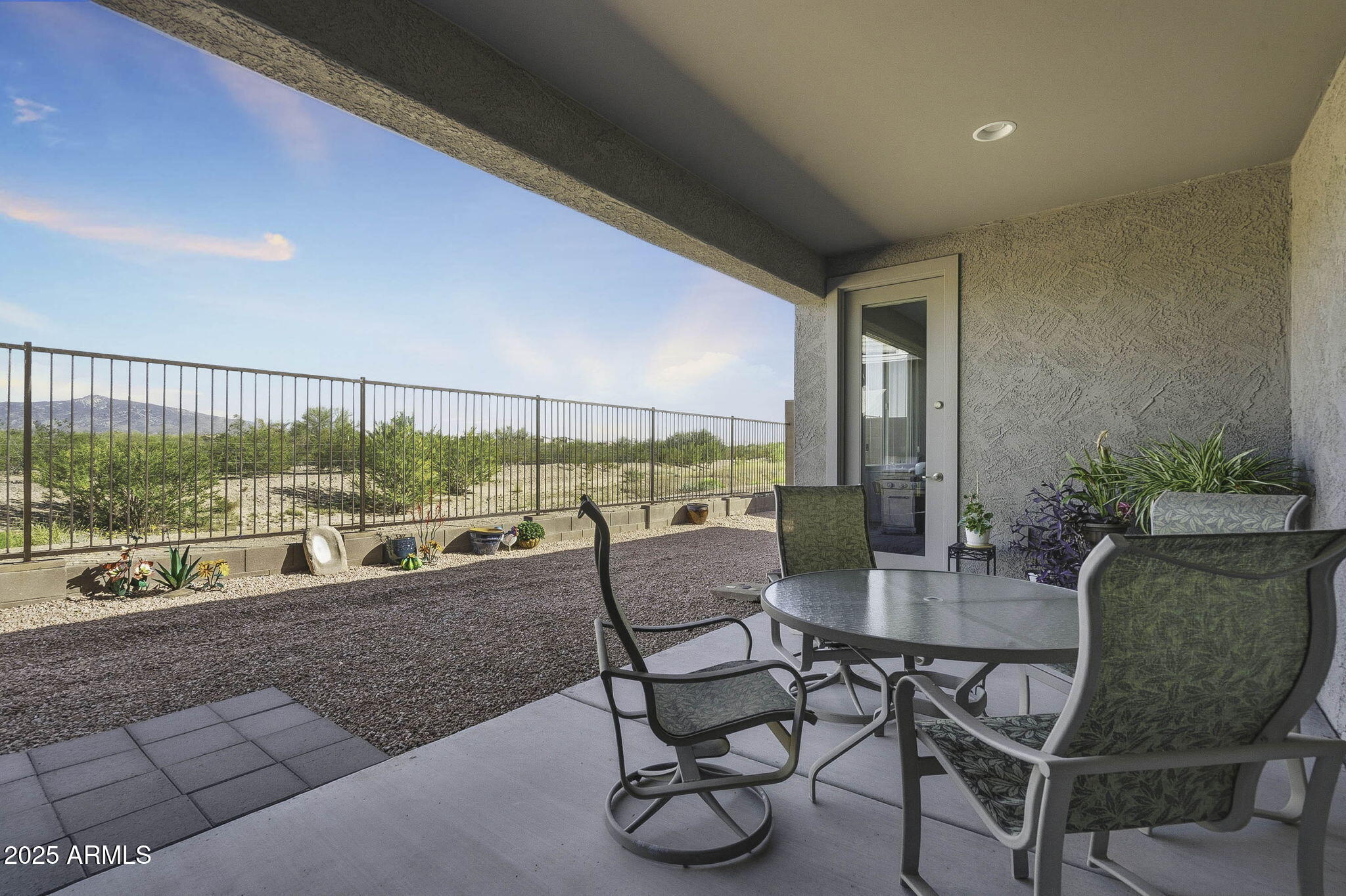 5439 South Sierra Prieta Trail Tucson, AZ 85747 - Photo 33 of 71 a dining room with furniture and a floor to ceiling window