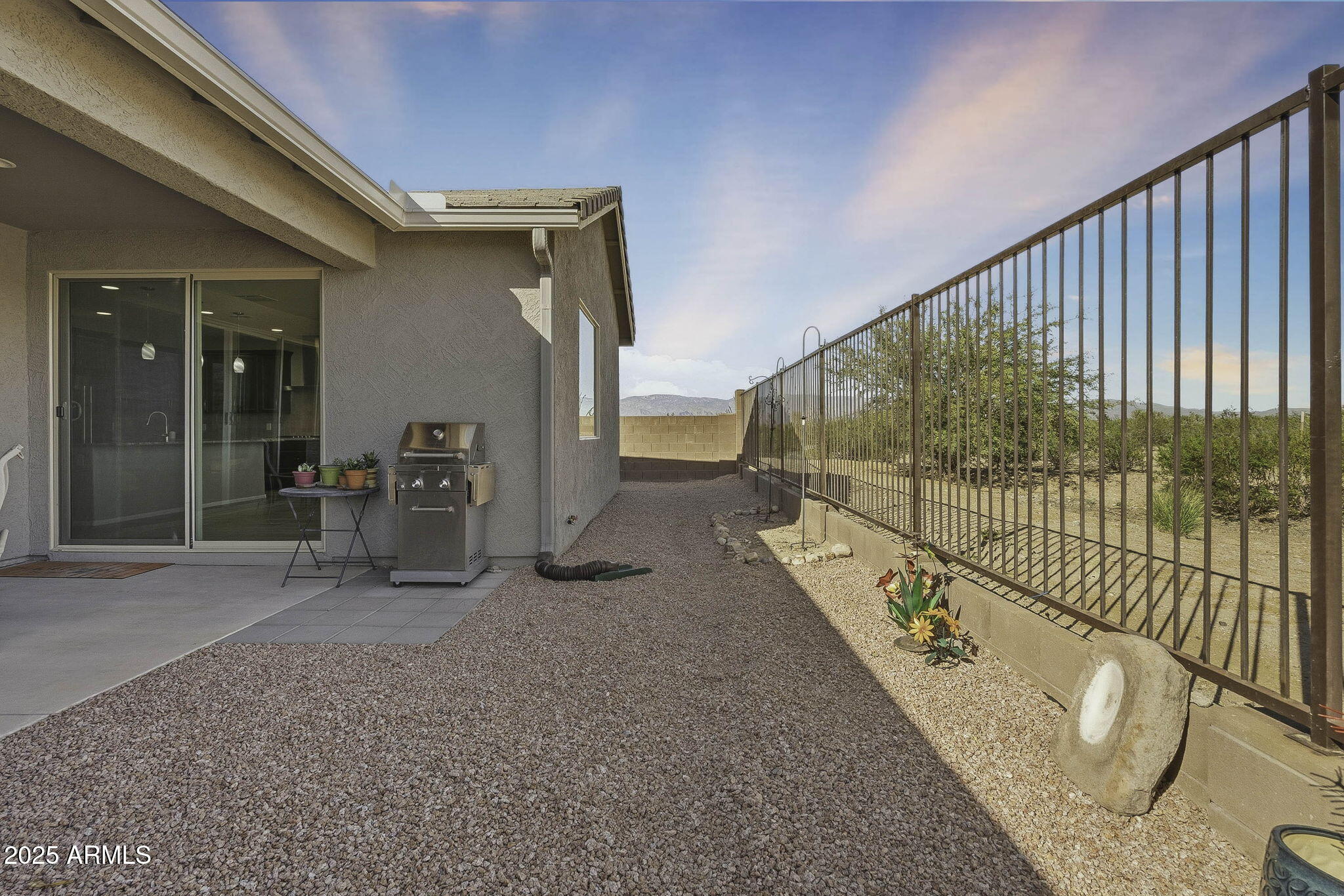 5439 South Sierra Prieta Trail Tucson, AZ 85747 - Photo 35 of 71 a view of a porch with wooden floor and iron stairs