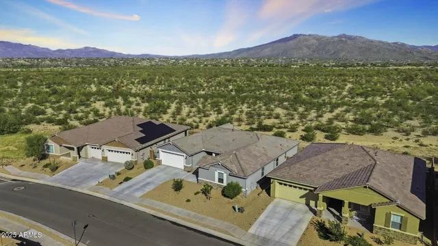 a kitchen with stainless steel appliances granite countertop a sink and a refrigerator