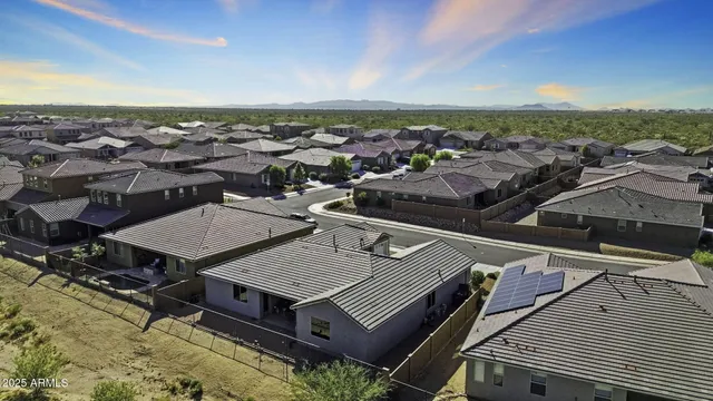 a bedroom with a bed a table and with chair