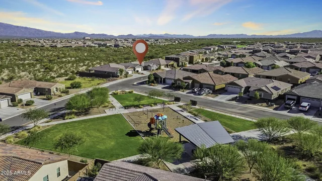 an aerial view of residential houses with outdoor space