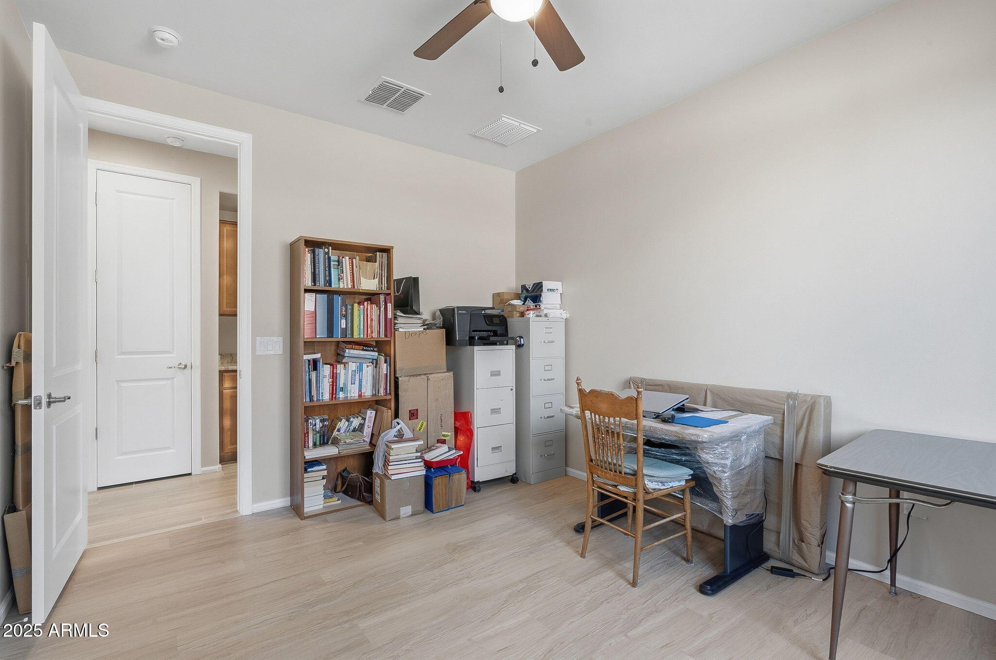 5439 South Sierra Prieta Trail Tucson, AZ 85747 - Photo 52 of 71 a view of a workspace with furniture and a ceiling fan
