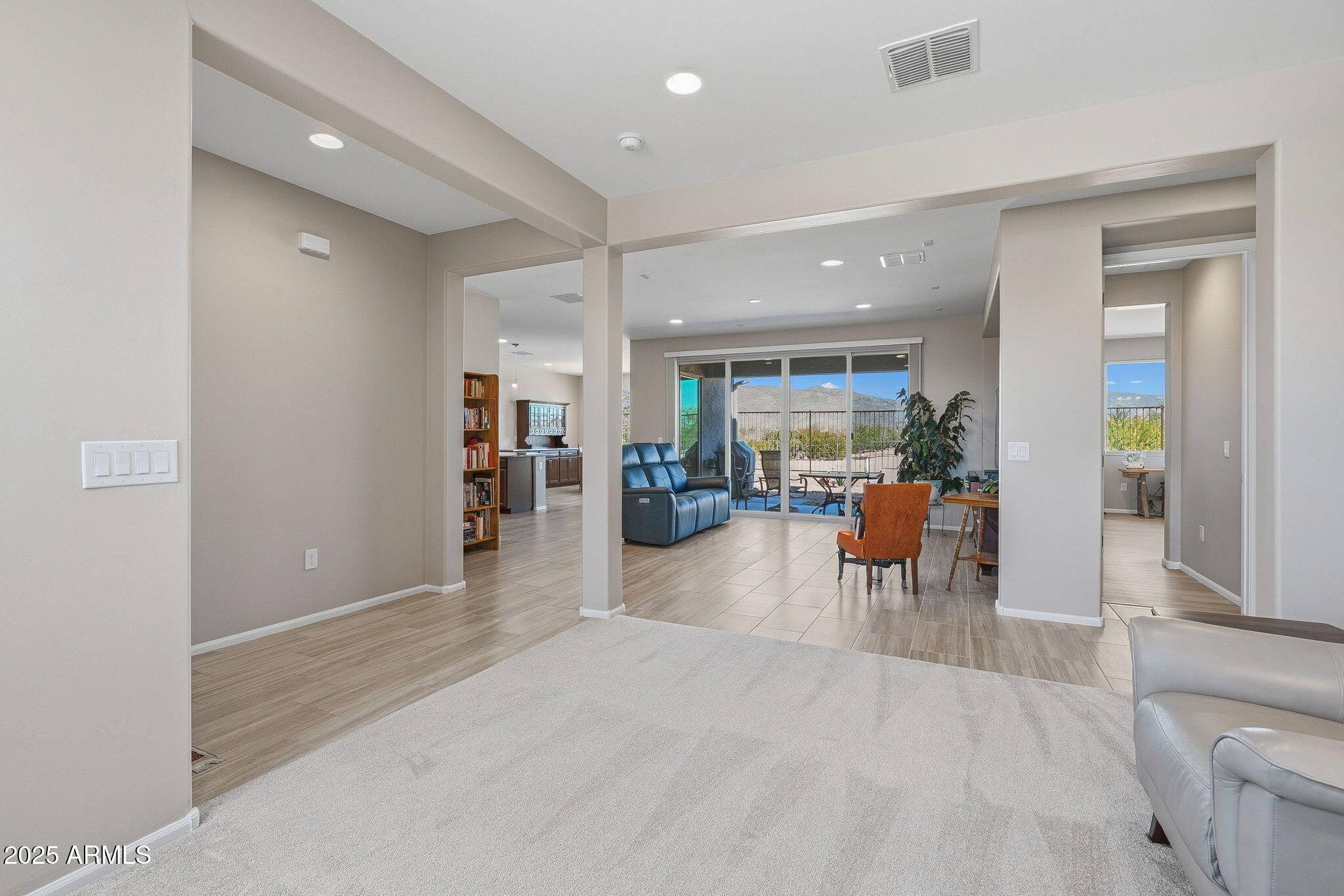 5439 South Sierra Prieta Trail Tucson, AZ 85747 - Photo 54 of 71 a living room with furniture and a wooden floor