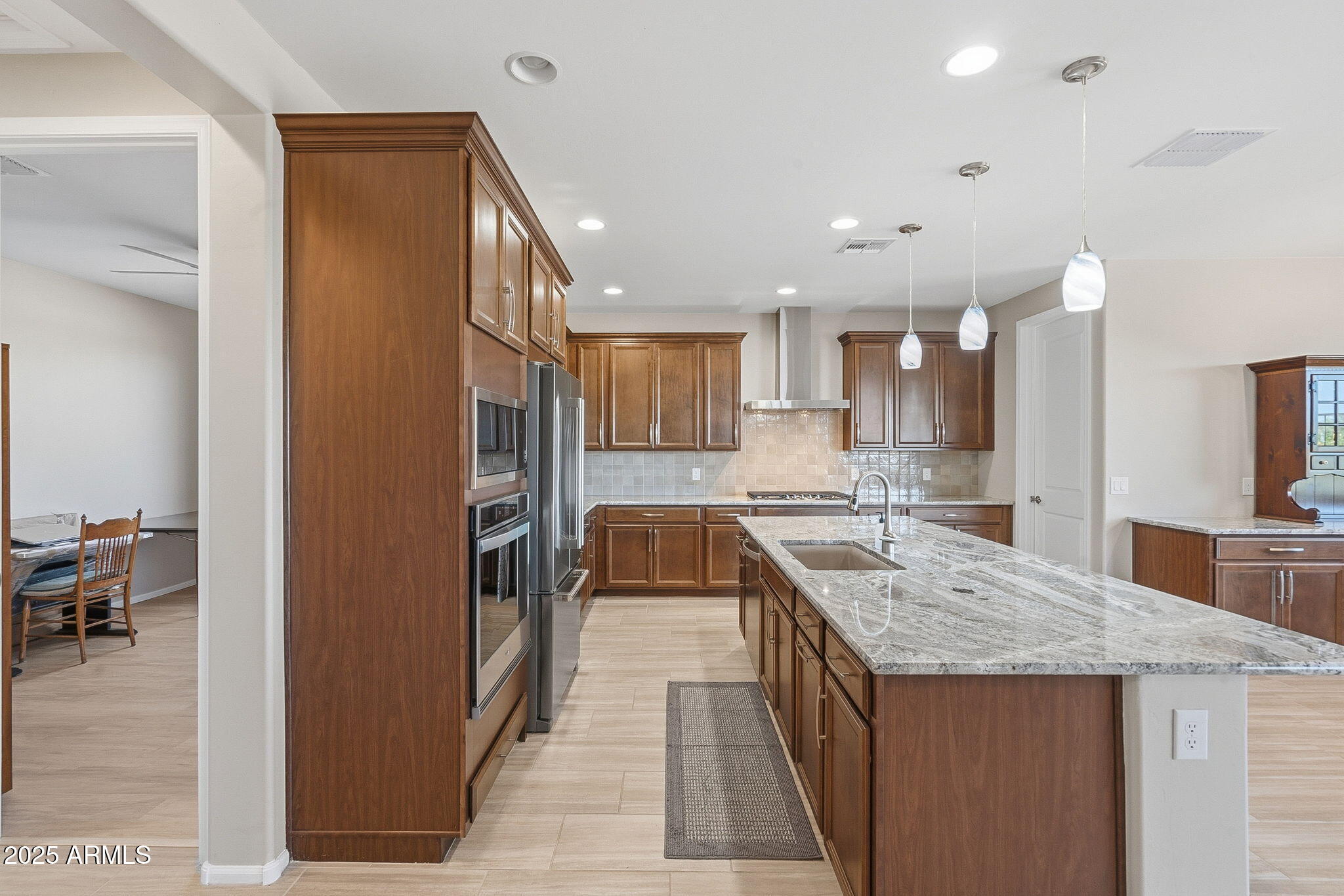 5439 South Sierra Prieta Trail Tucson, AZ 85747 - Photo 57 of 71 a kitchen with a sink stove and cabinets
