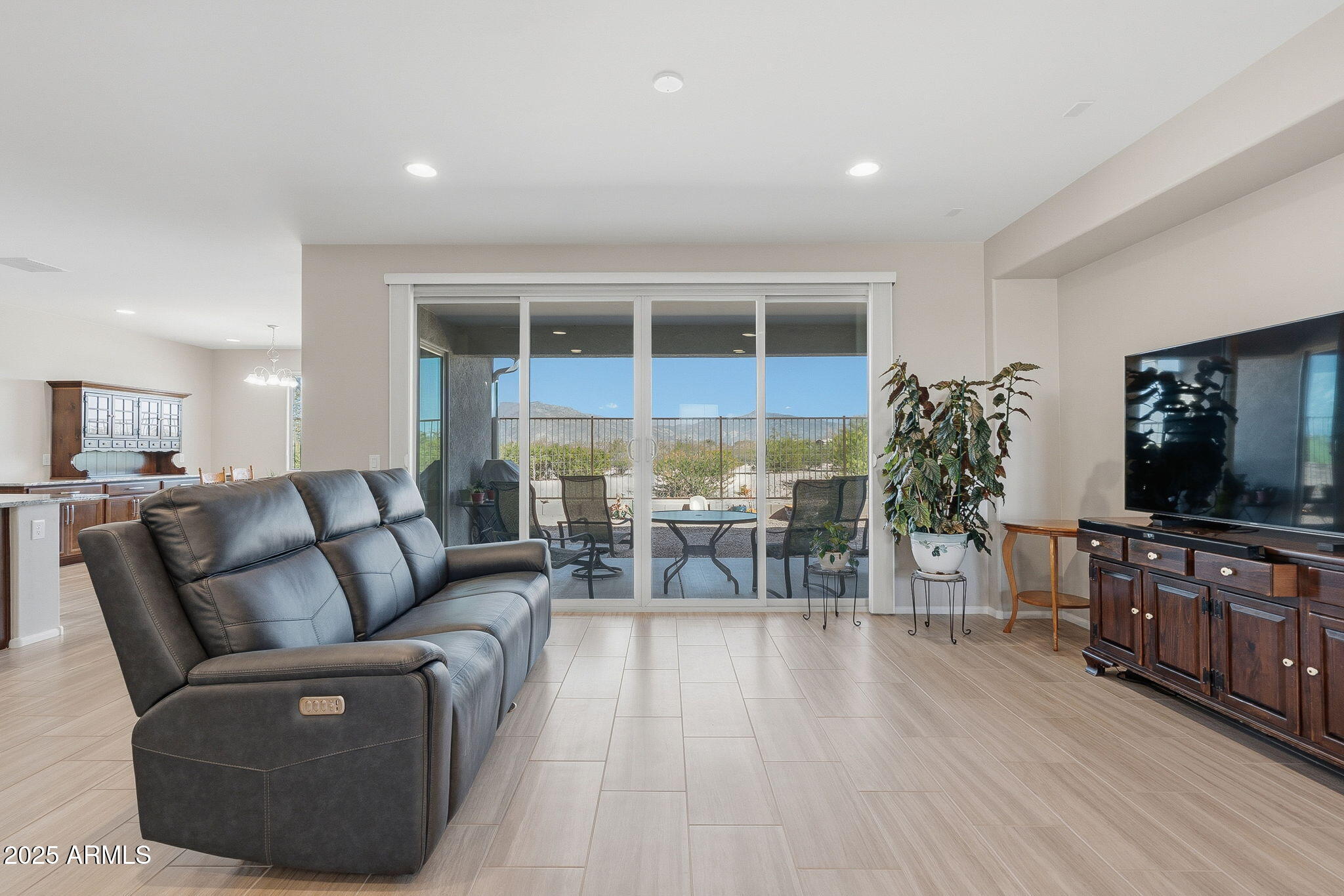 5439 South Sierra Prieta Trail Tucson, AZ 85747 - Photo 59 of 71 a living room with furniture and a flat screen tv
