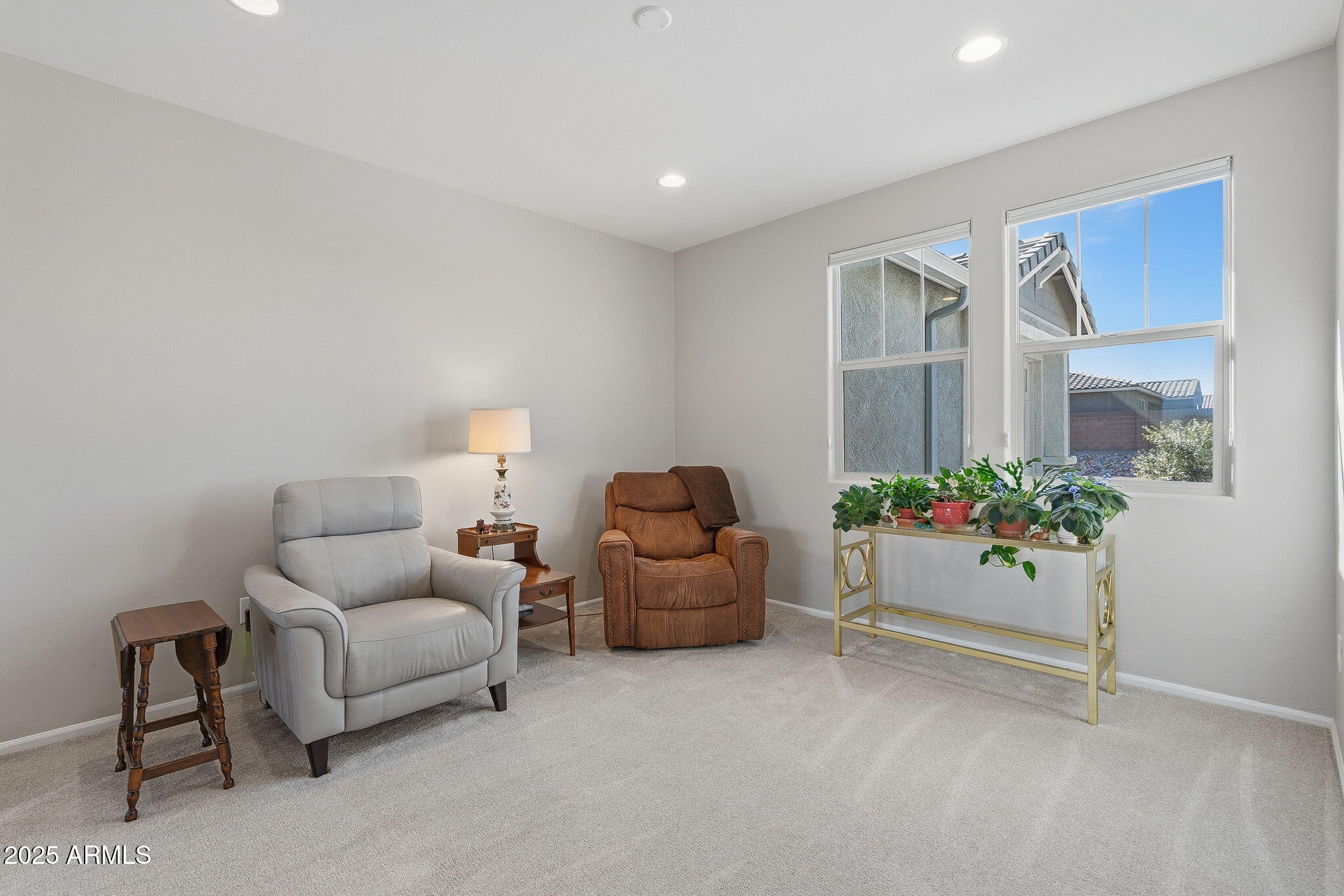 5439 South Sierra Prieta Trail Tucson, AZ 85747 - Photo 62 of 71 a living room with furniture and flowers
