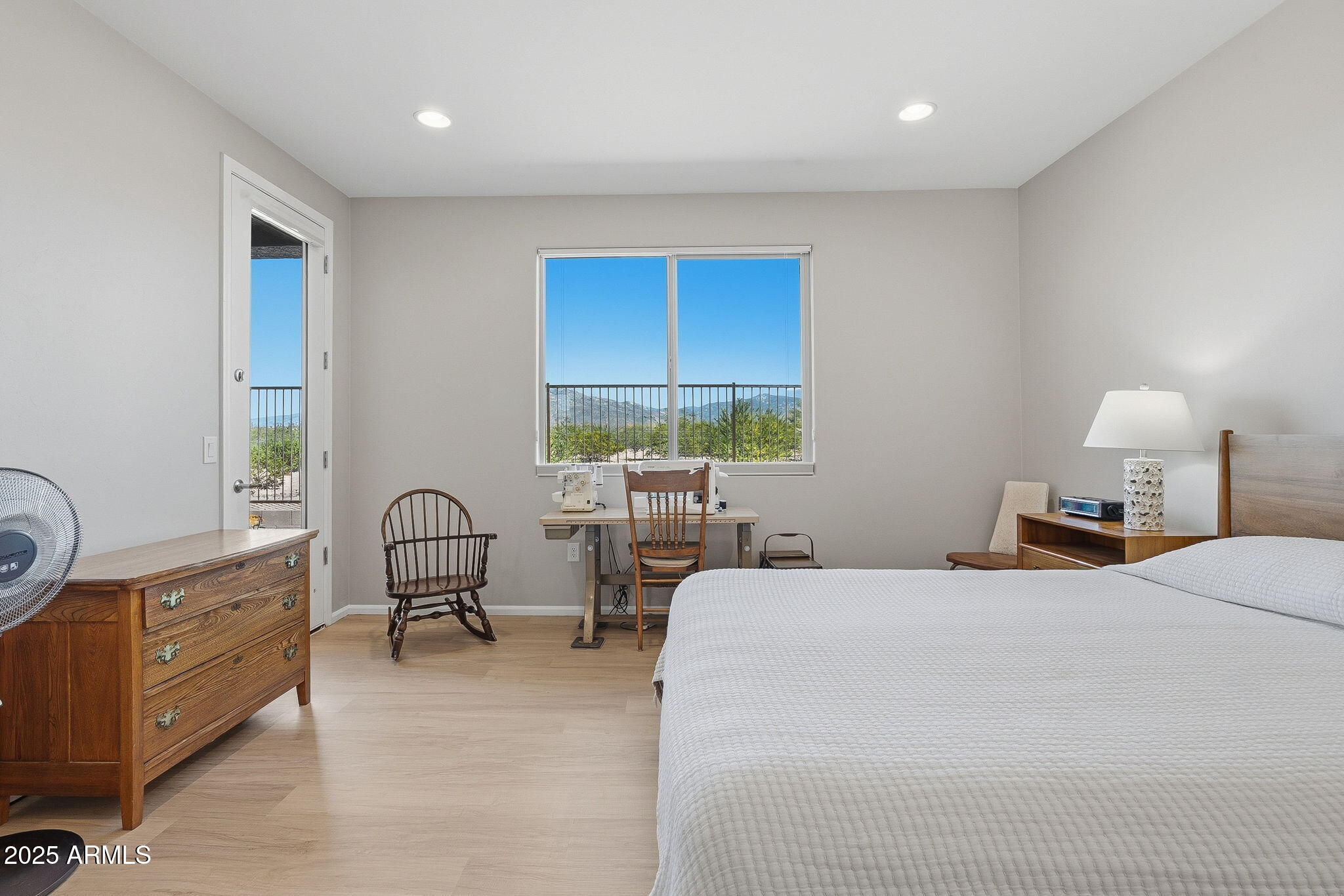 5439 South Sierra Prieta Trail Tucson, AZ 85747 - Photo 66 of 71 a bedroom with a bed a table and with chair