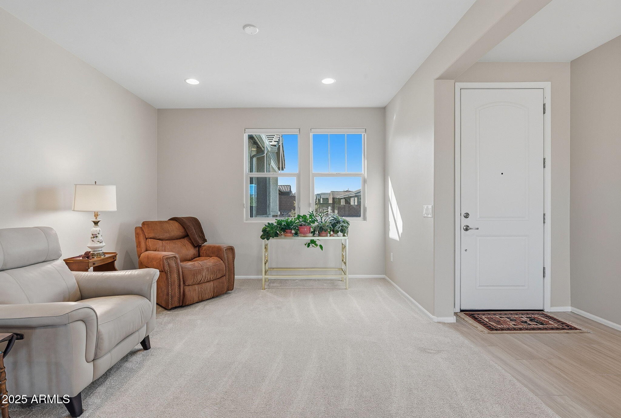 5439 South Sierra Prieta Trail Tucson, AZ 85747 - Photo 6 of 71 a living room with furniture a rug and a window