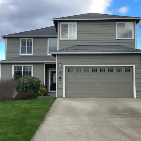 a front view of a house with garden