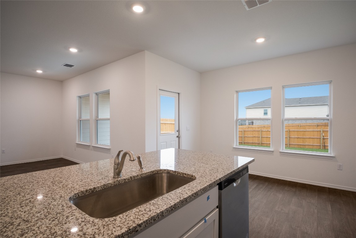 15009 Welsh Cob St Manor, Unit A Manor, TX 78653 - Photo 12 of 24 a kitchen with a sink and a window