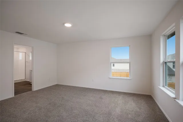 a bathroom with a double vanity sink mirror and shower