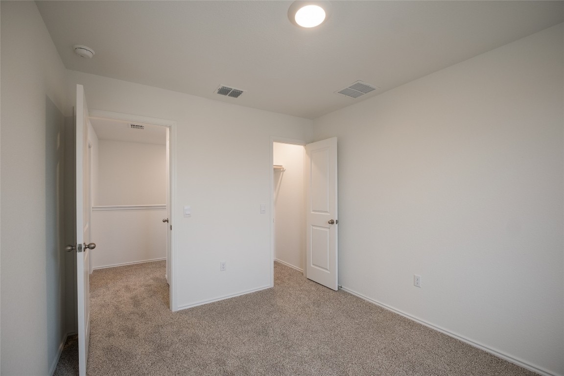 15009 Welsh Cob St Manor, Unit A Manor, TX 78653 - Photo 23 of 24 an empty room with closet area