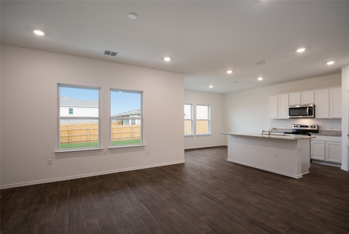 15009 Welsh Cob St Manor, Unit A Manor, TX 78653 - Photo 8 of 24 a view of kitchen and microwave