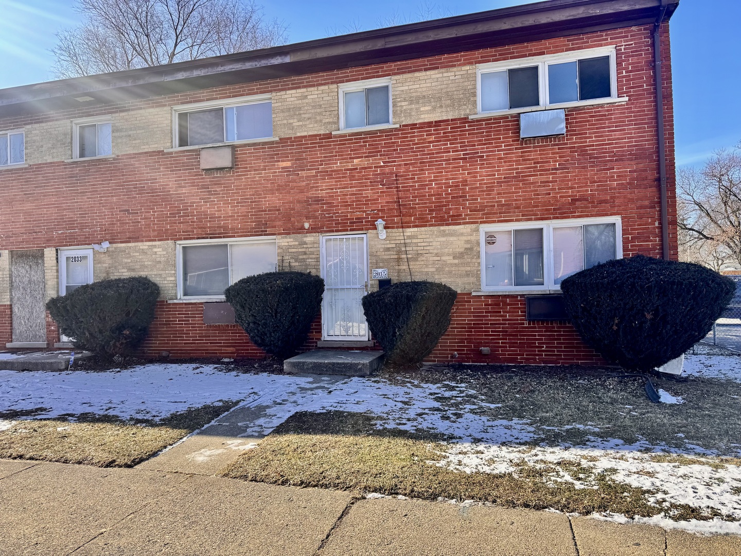 a brick building with glass windows