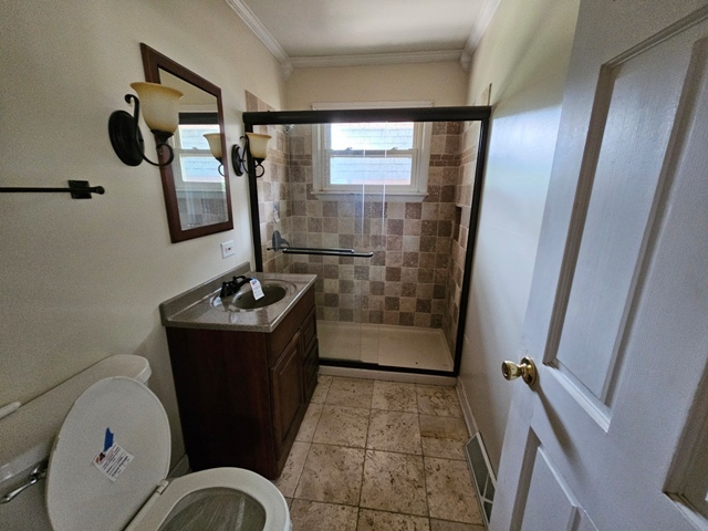 1004 Jenkisson Avenue Lake Bluff, IL 60044 - Photo 9 of 10 a bathroom with a sink and mirror with bathtub